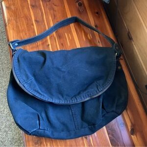 Large black canvas bag with colorful lining
